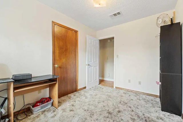 a view of a livingroom with a hallway