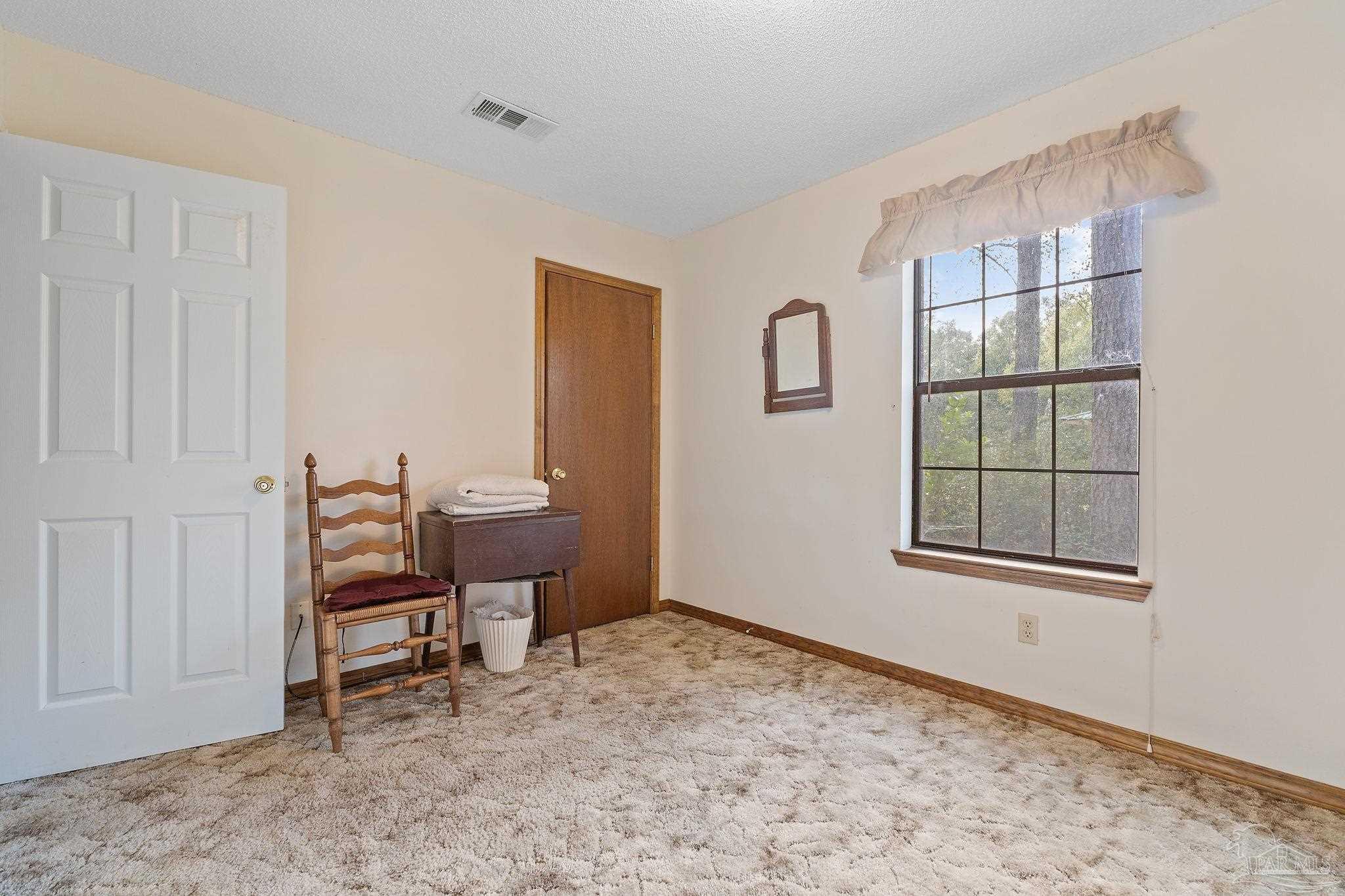 2329 Camors Road Jay, FL 32565 - Photo 17 of 28 a view of a room that has a window in it