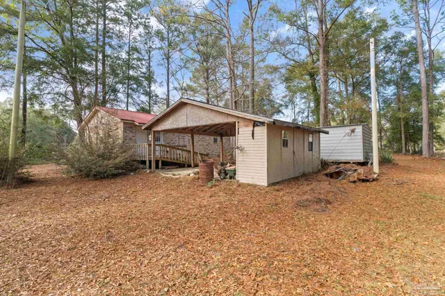 a house with trees in the background
