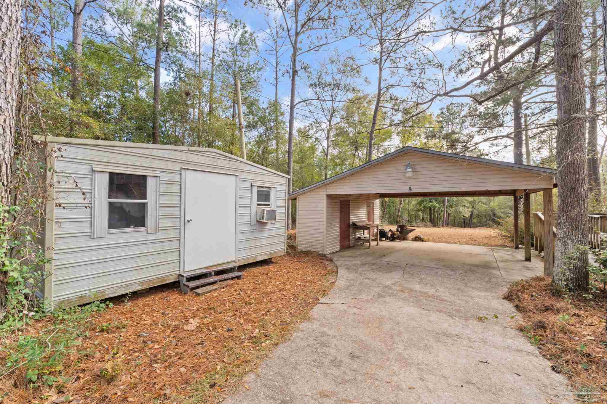 2329 Camors Road Jay, FL 32565 - Photo 27 of 28 a house view with a backyard space