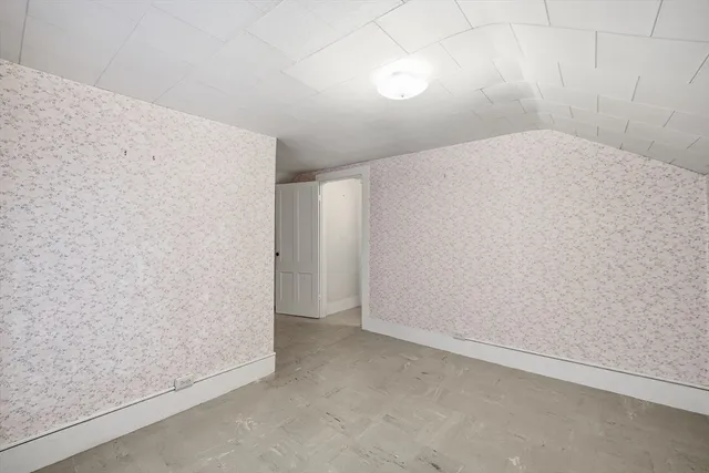 an empty room with a bench