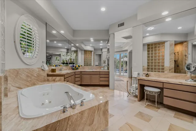 a view of a patio with table and chairs potted plants and a large tree