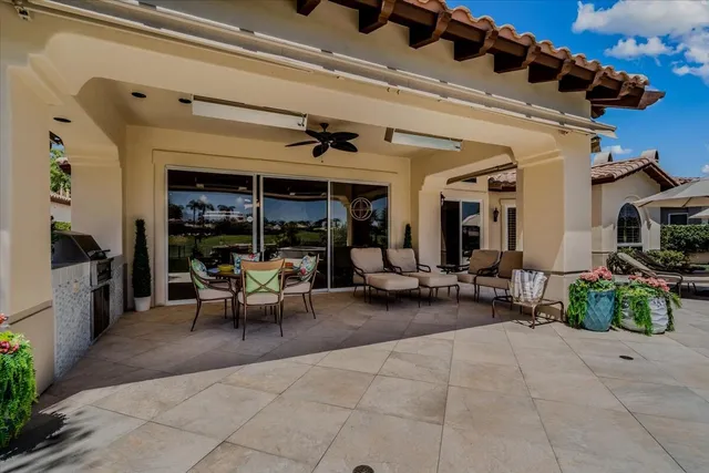 a view of a swimming pool and lounge chairs