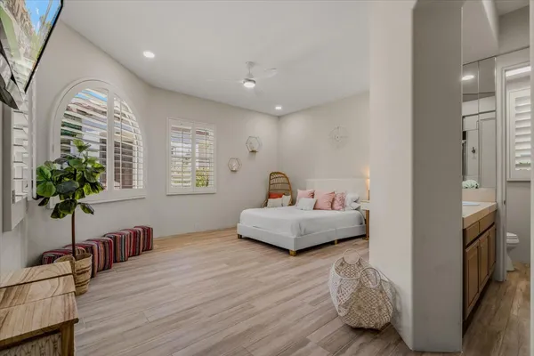 an aerial view of a house with a garden and lake view