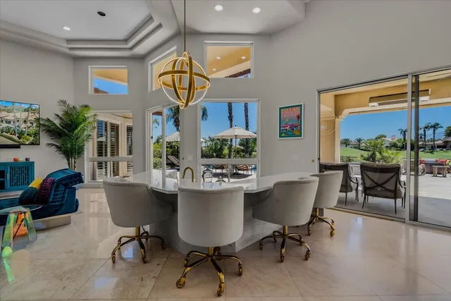 a outdoor dining space with furniture and a potted plant
