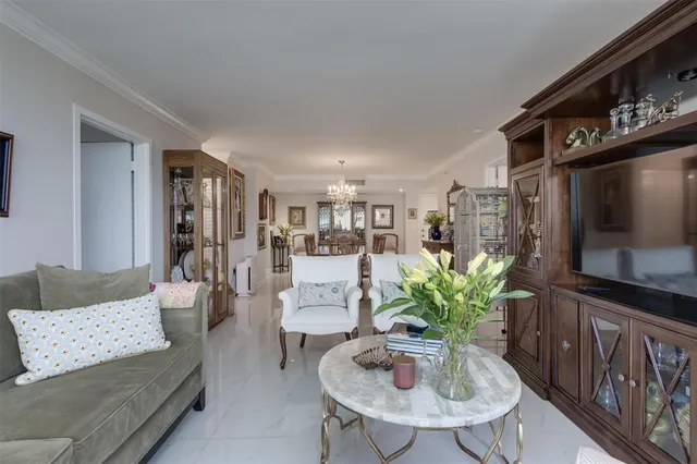 a kitchen with stainless steel appliances granite countertop a refrigerator a stove top oven a sink and dishwasher