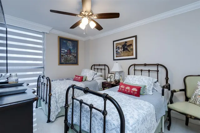 a dining hall with stainless steel appliances a dining table and chairs with kitchen island