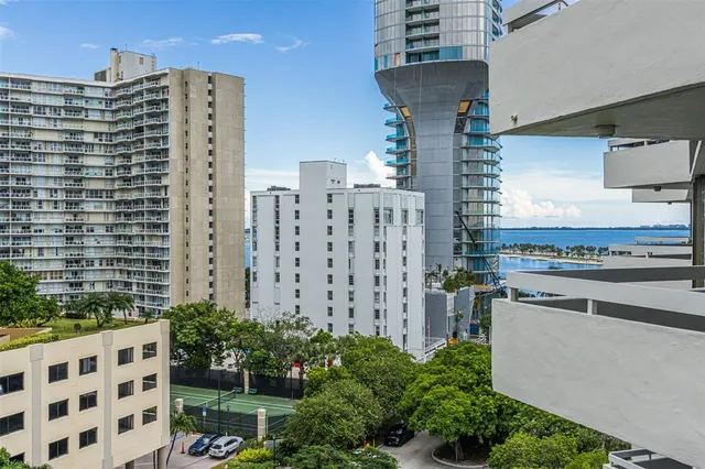 a view of a dining room with furniture and a chandelier