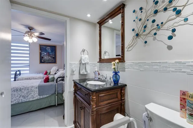 a bedroom with a bed a desk and chair