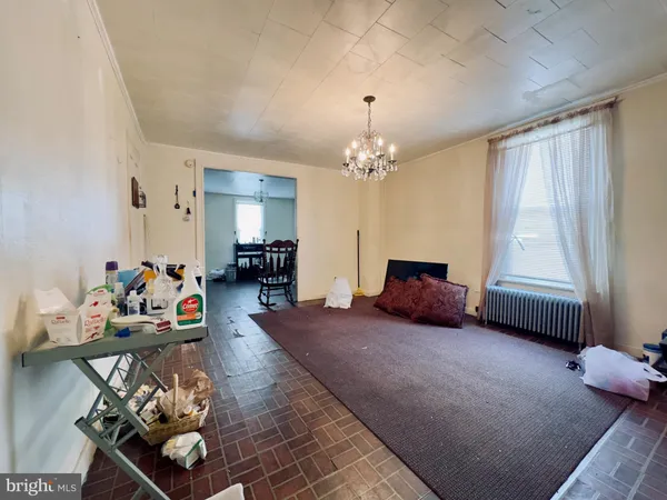 a bedroom with furniture and a chandelier