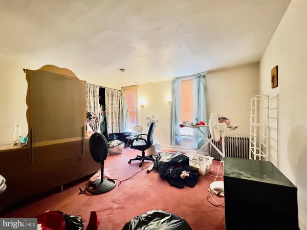 a bedroom with bed and a window