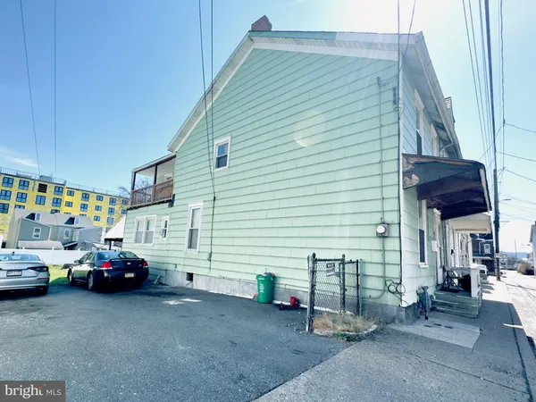 a view of a cars park in front of house