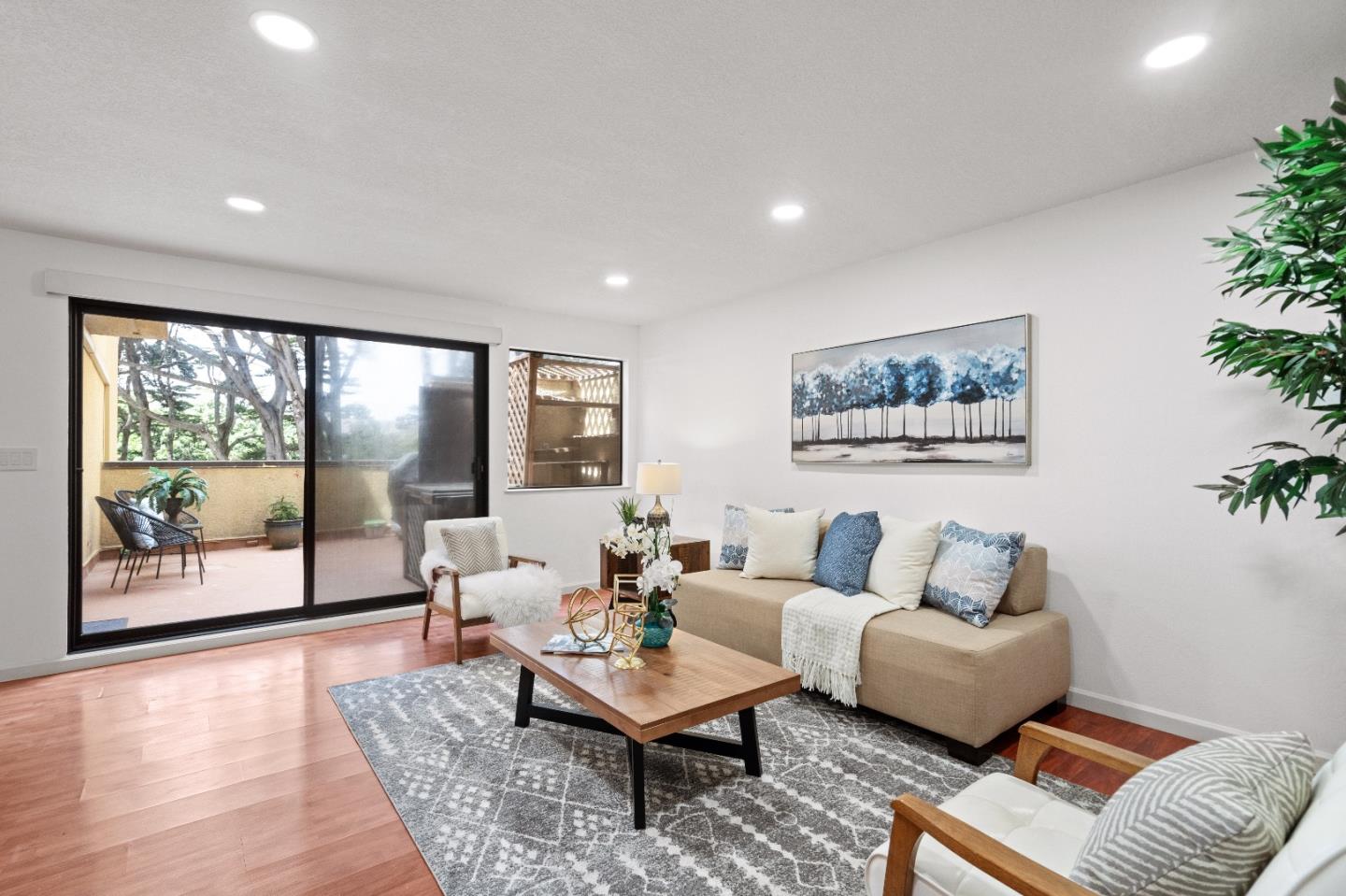 1 Appian Way, Unit 7132 South San Francisco, CA 94080 - Photo 1 of 36 a living room with furniture and a large window with wooden floor