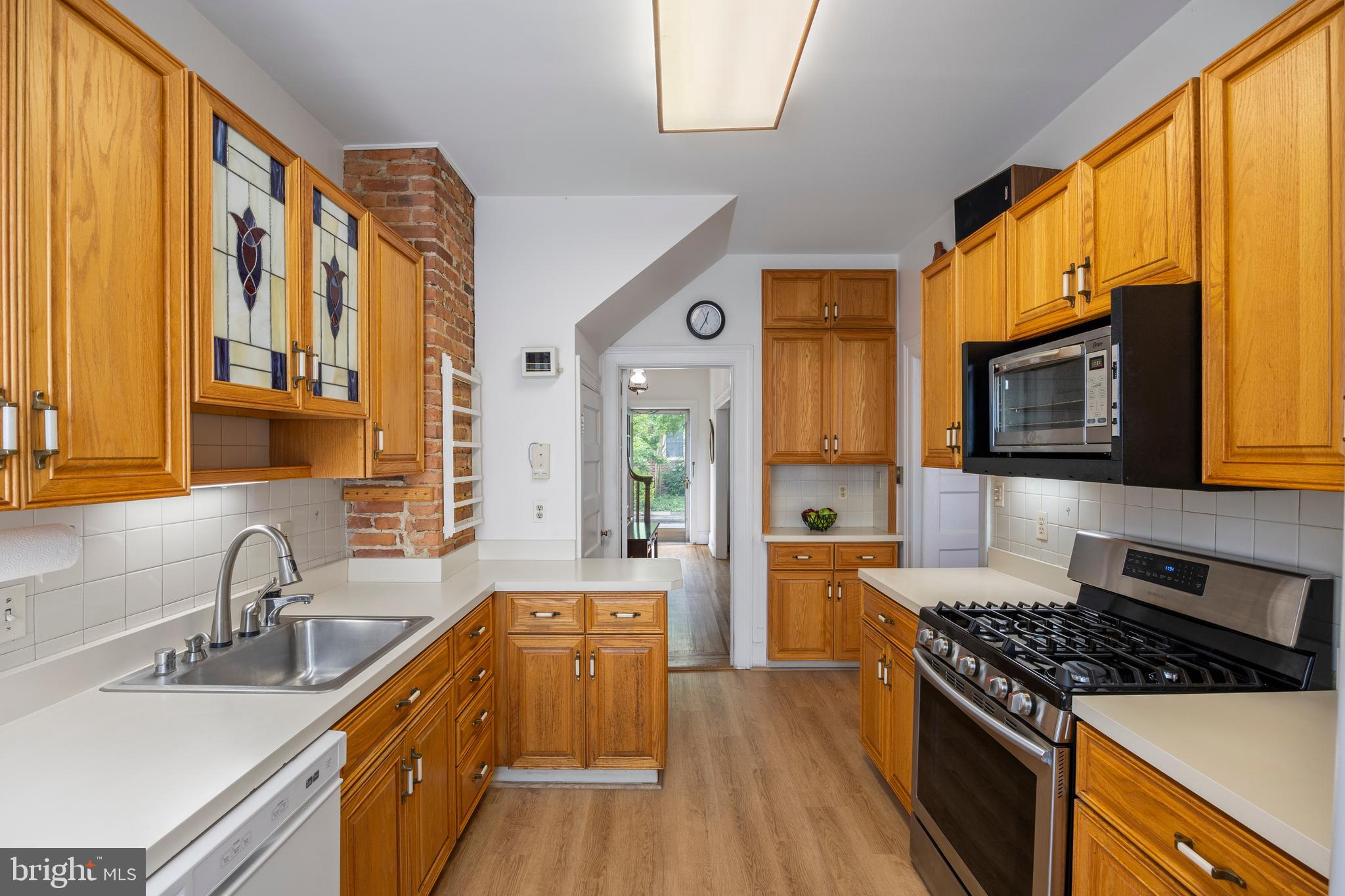 3936 Cloverhill Road Baltimore, MD 21218 - Photo 12 of 37 a kitchen with stainless steel appliances granite countertop a stove and a sink