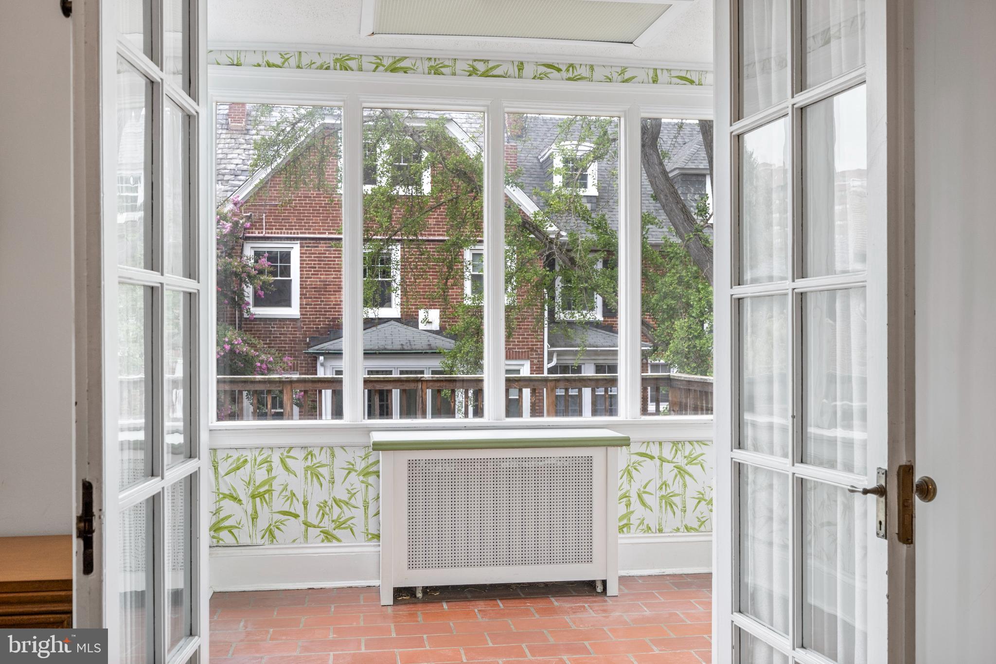 3936 Cloverhill Road Baltimore, MD 21218 - Photo 15 of 37 a front view of a building with glass windows and brick walls