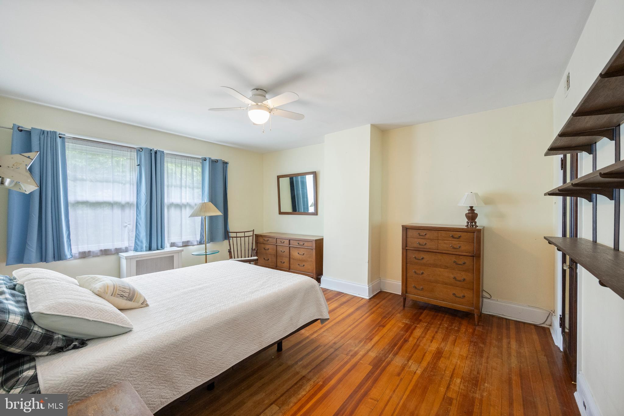 3936 Cloverhill Road Baltimore, MD 21218 - Photo 18 of 37 a bedroom with a bed and a book shelf