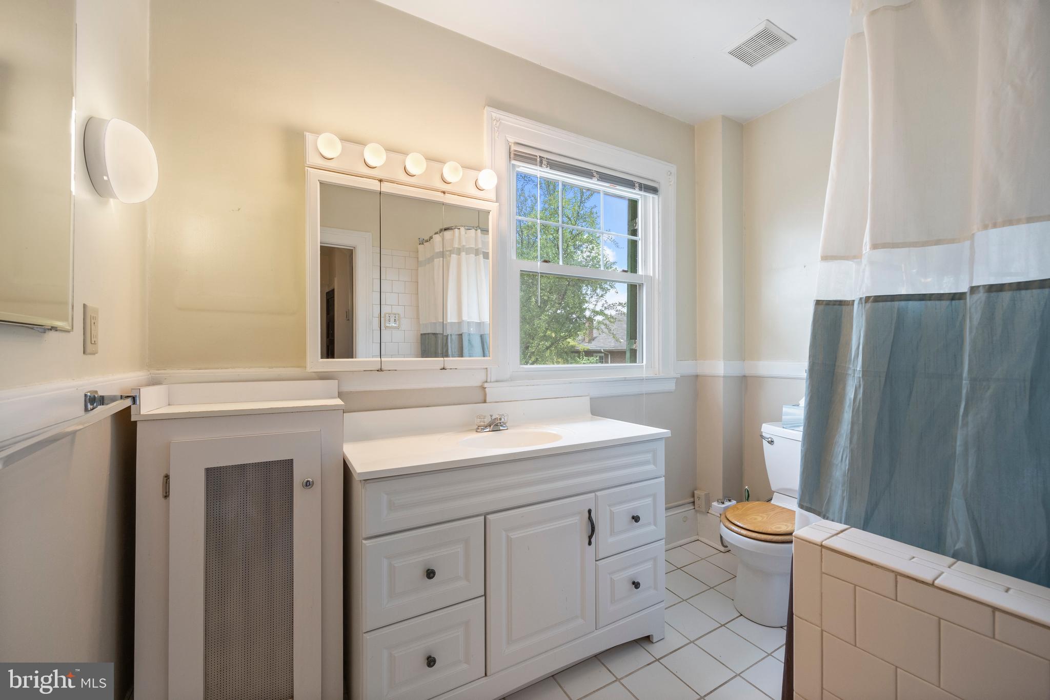 3936 Cloverhill Road Baltimore, MD 21218 - Photo 23 of 37 a bathroom with a sink toilet and shower
