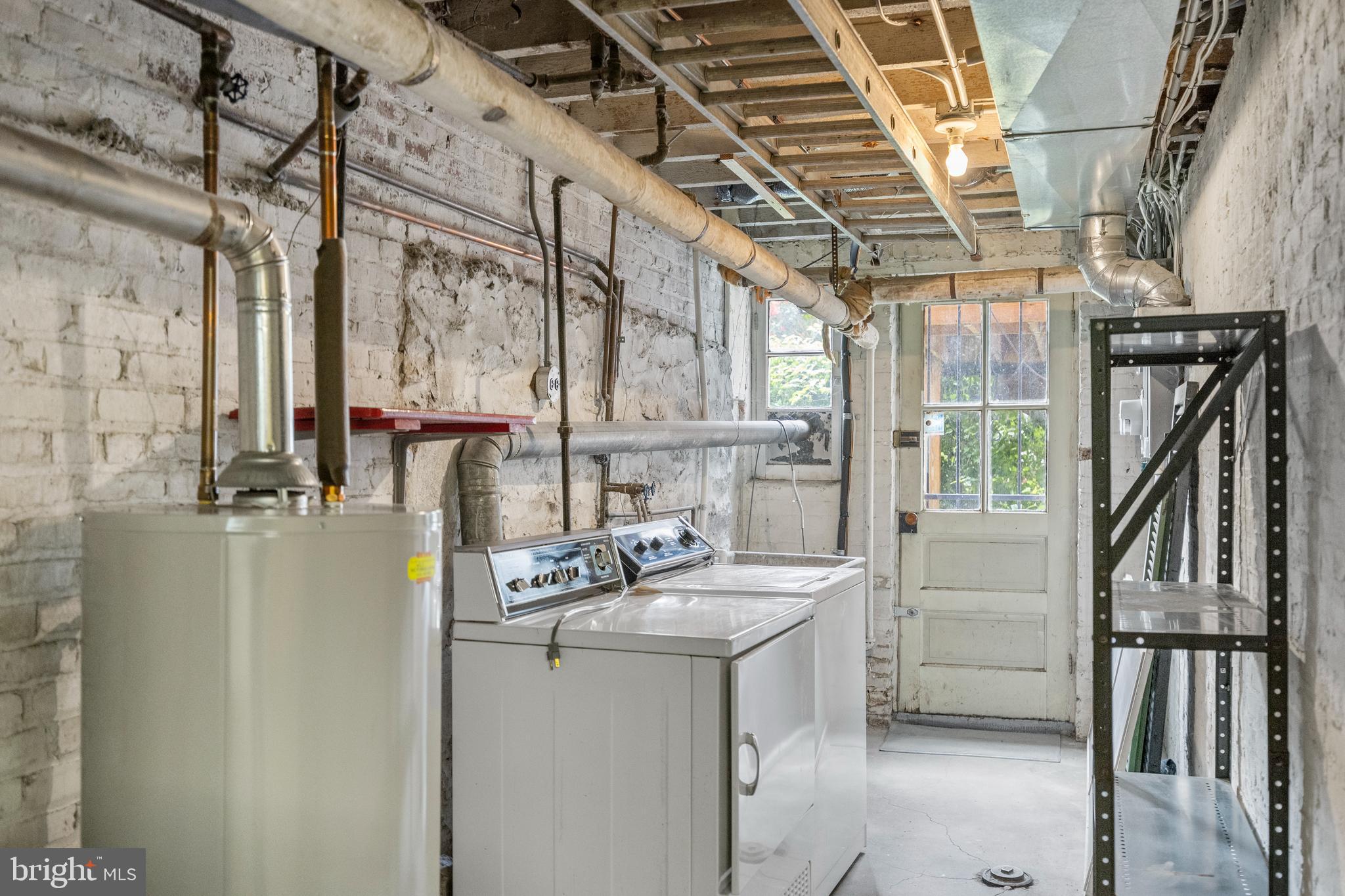3936 Cloverhill Road Baltimore, MD 21218 - Photo 30 of 37 a utility room with dryer and washer