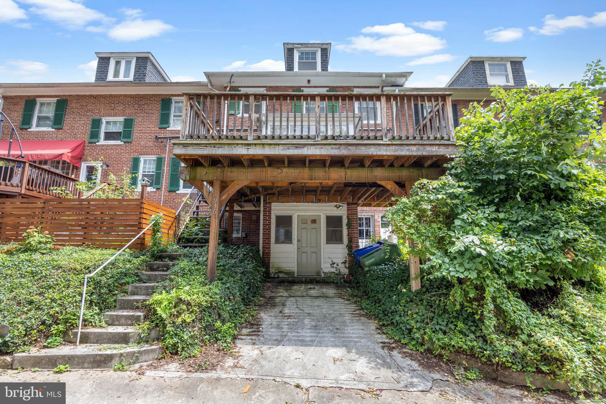 3936 Cloverhill Road Baltimore, MD 21218 - Photo 36 of 37 front view of a house with a yard