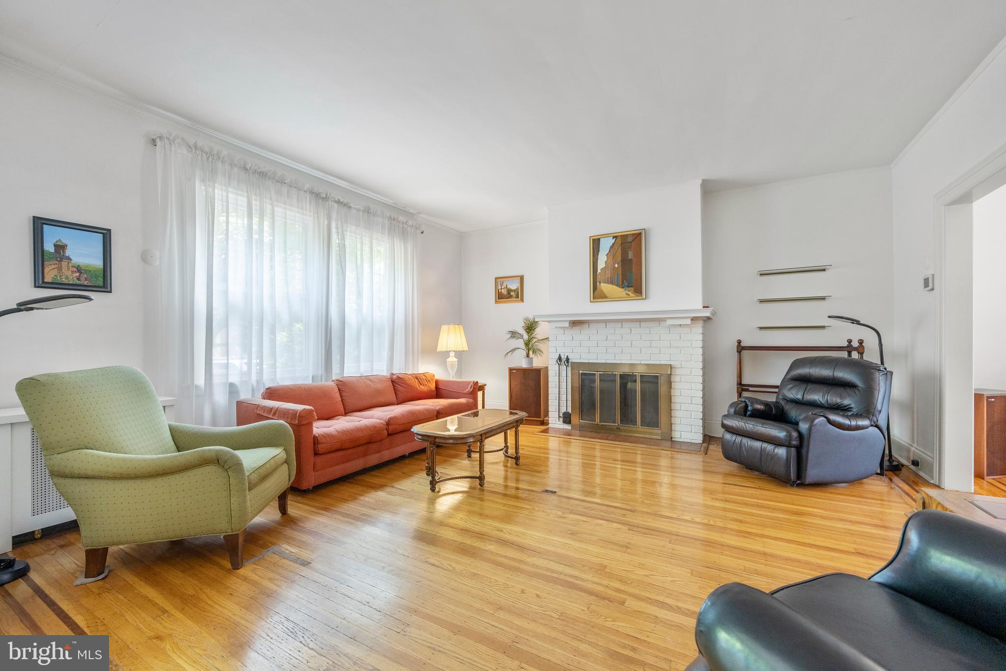 3936 Cloverhill Road Baltimore, MD 21218 - Photo 5 of 37 a living room with furniture and a fireplace