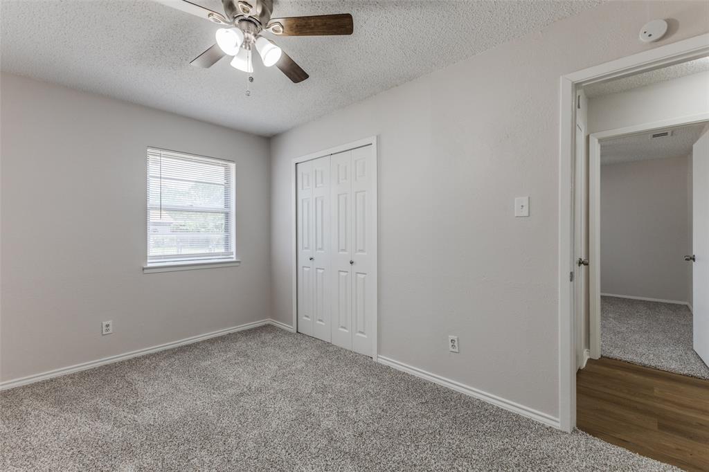 3921 Ambassador Way Balch Springs, TX 75180 - Photo 15 of 25 a view of an empty room with a window