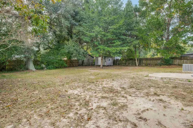 a backyard of a house with lots of green space