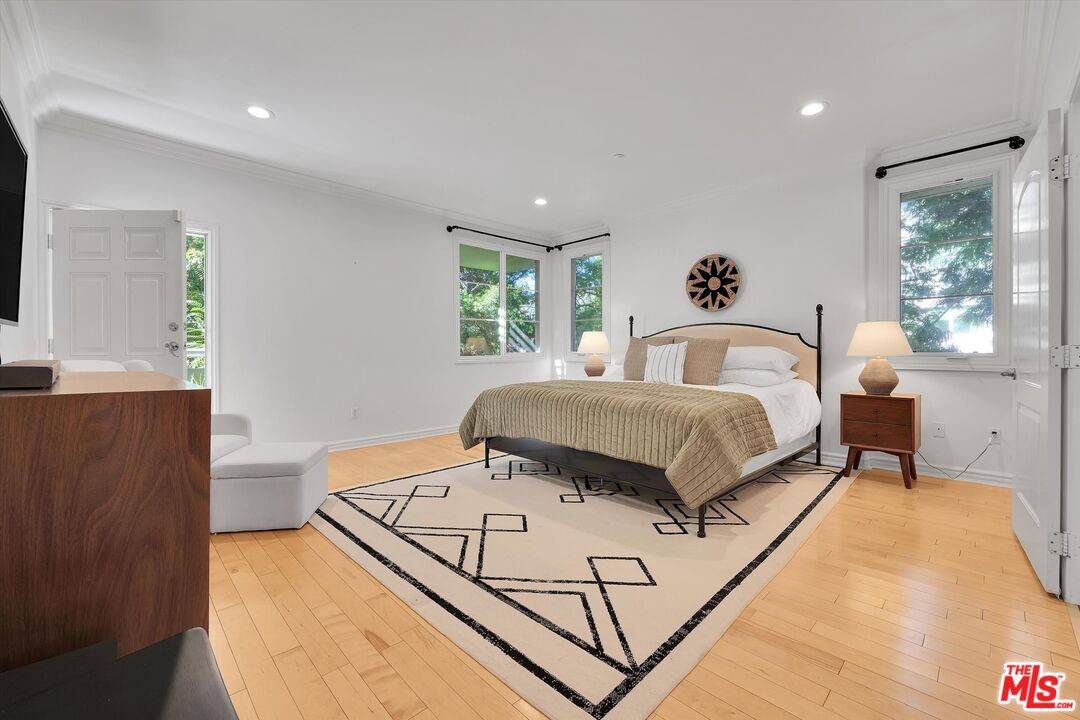 1601 South Bentley Avenue, Unit 211 Los Angeles, CA 90025 - Photo 11 of 30 a bedroom with a bed and a potted plant