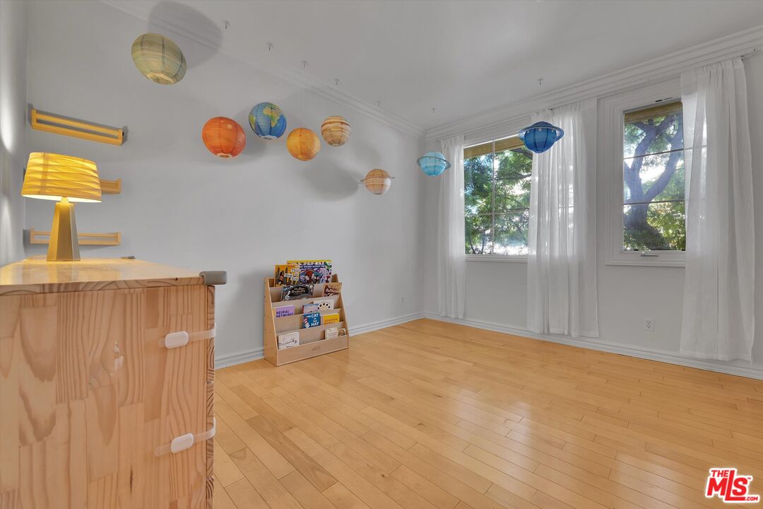 1601 South Bentley Avenue, Unit 211 Los Angeles, CA 90025 - Photo 15 of 30 a view of a room with gym equipment and a window