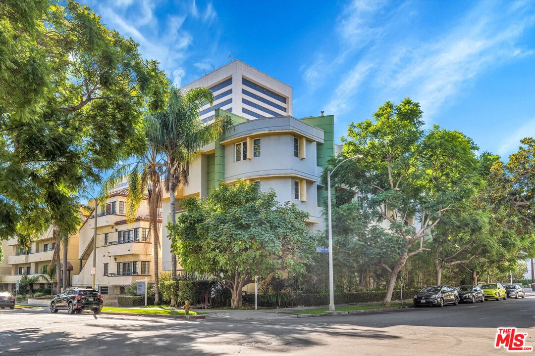 1601 South Bentley Avenue, Unit 211 Los Angeles, CA 90025 - Photo 29 of 30 a front view of a building with a garden