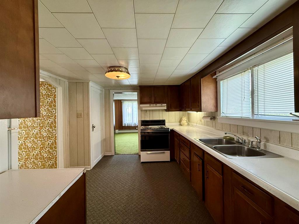 222 Bagdad Road Leechburg, PA 15656 - Photo 12 of 23 a kitchen with a sink and a stove top oven