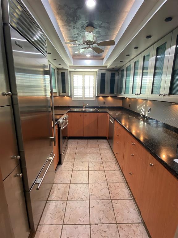 1500 Gay Road, Unit 17D Winter Park, FL 32789 - Photo 11 of 34 a large kitchen with a large counter top stainless steel appliances and cabinets