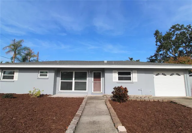 a front view of a house with a garage