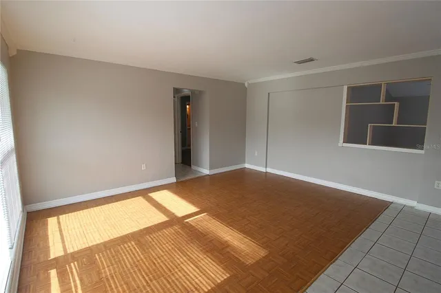 a view of an empty room and window