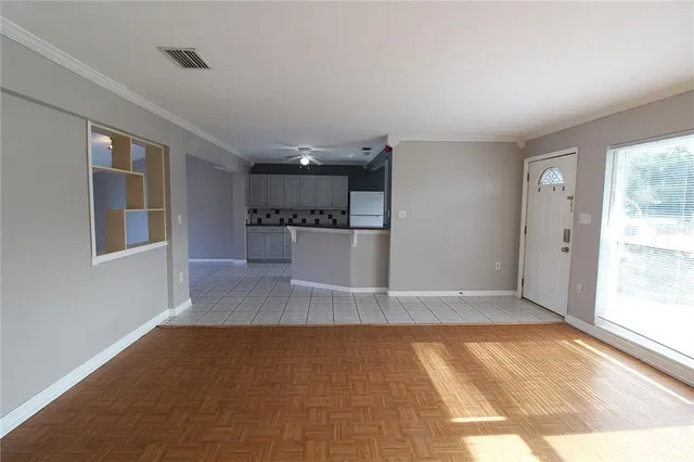 a view of a kitchen with a sink and a window
