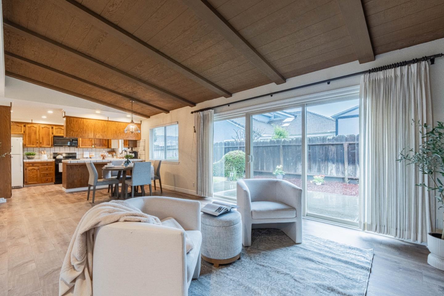 1130 Montecito Circle Salinas, CA 93901 - Photo 11 of 32 a living room with furniture and three windows