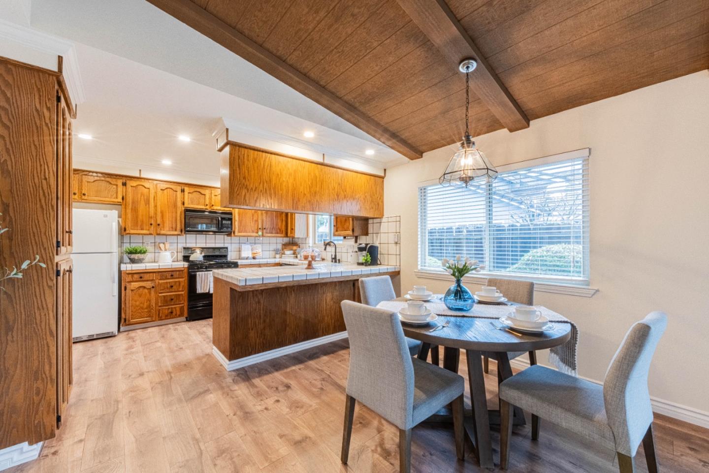 1130 Montecito Circle Salinas, CA 93901 - Photo 13 of 32 a kitchen with a table and chairs in it