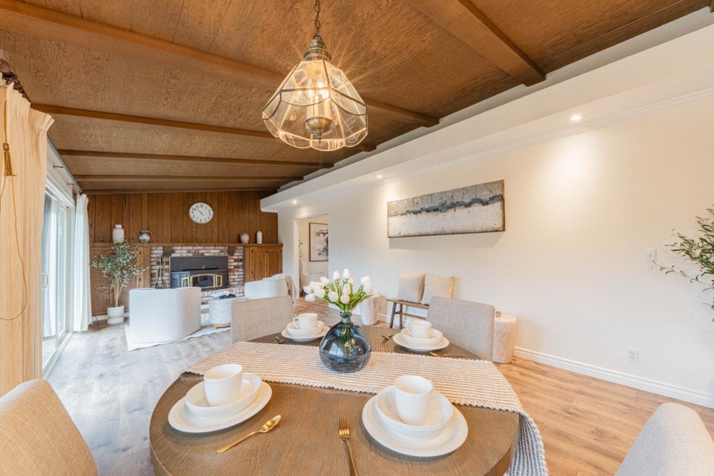1130 Montecito Circle Salinas, CA 93901 - Photo 14 of 32 a dining room with furniture a chandelier and wooden floor