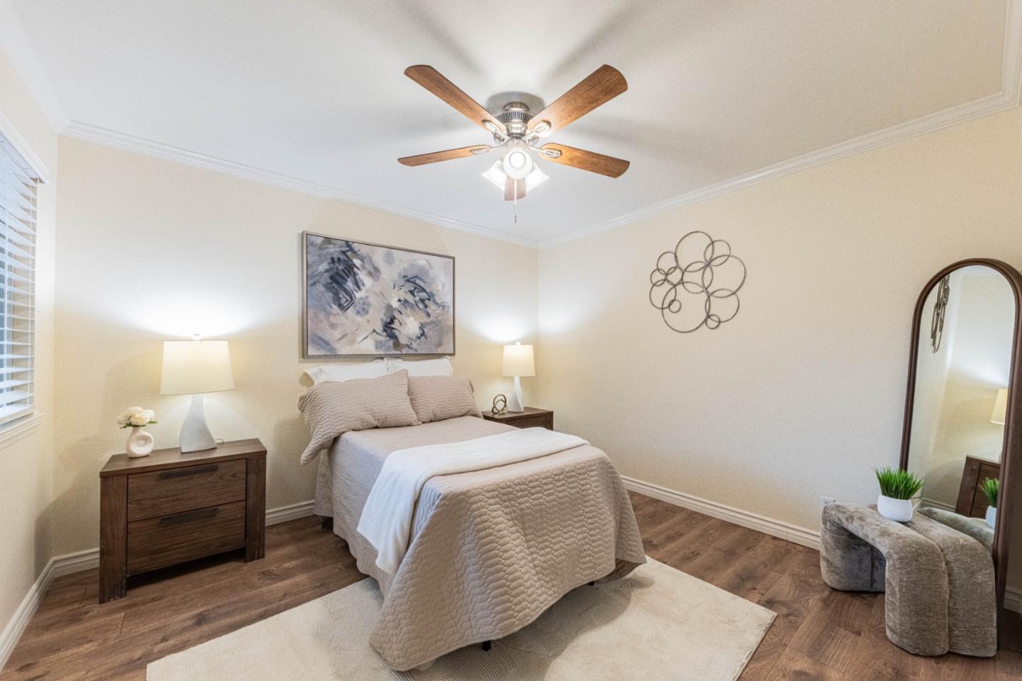 1130 Montecito Circle Salinas, CA 93901 - Photo 23 of 32 a bedroom with a large bed and a chandelier