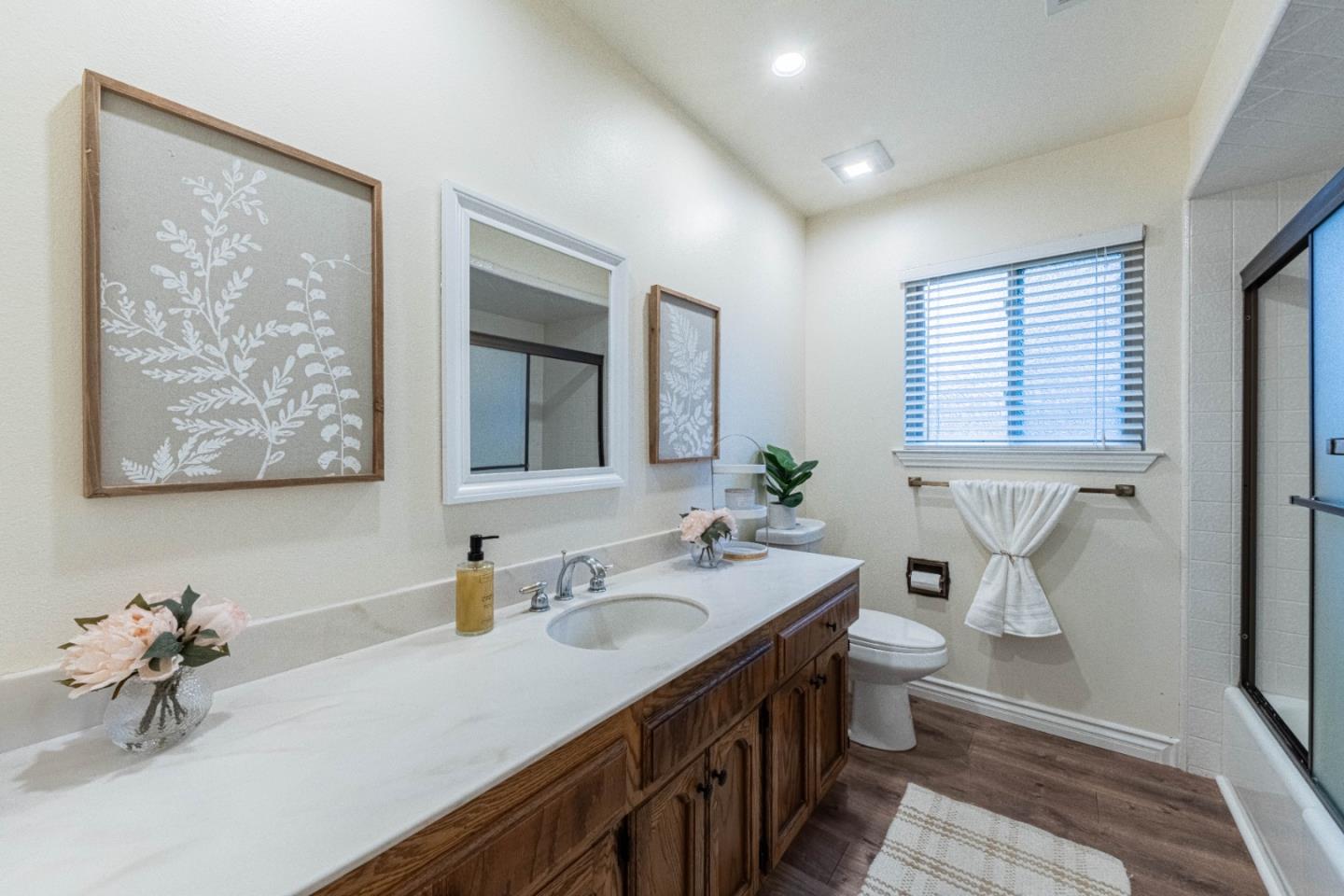 1130 Montecito Circle Salinas, CA 93901 - Photo 27 of 32 a bathroom with a double vanity sink and a mirror