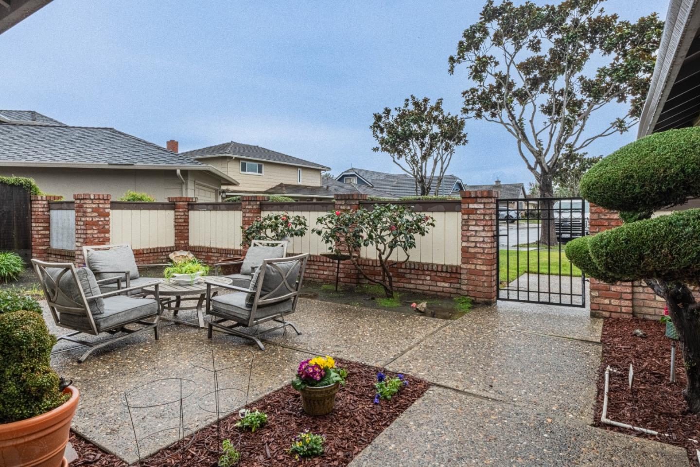 1130 Montecito Circle Salinas, CA 93901 - Photo 3 of 32 a view of a patio with couches table and chairs and potted plants