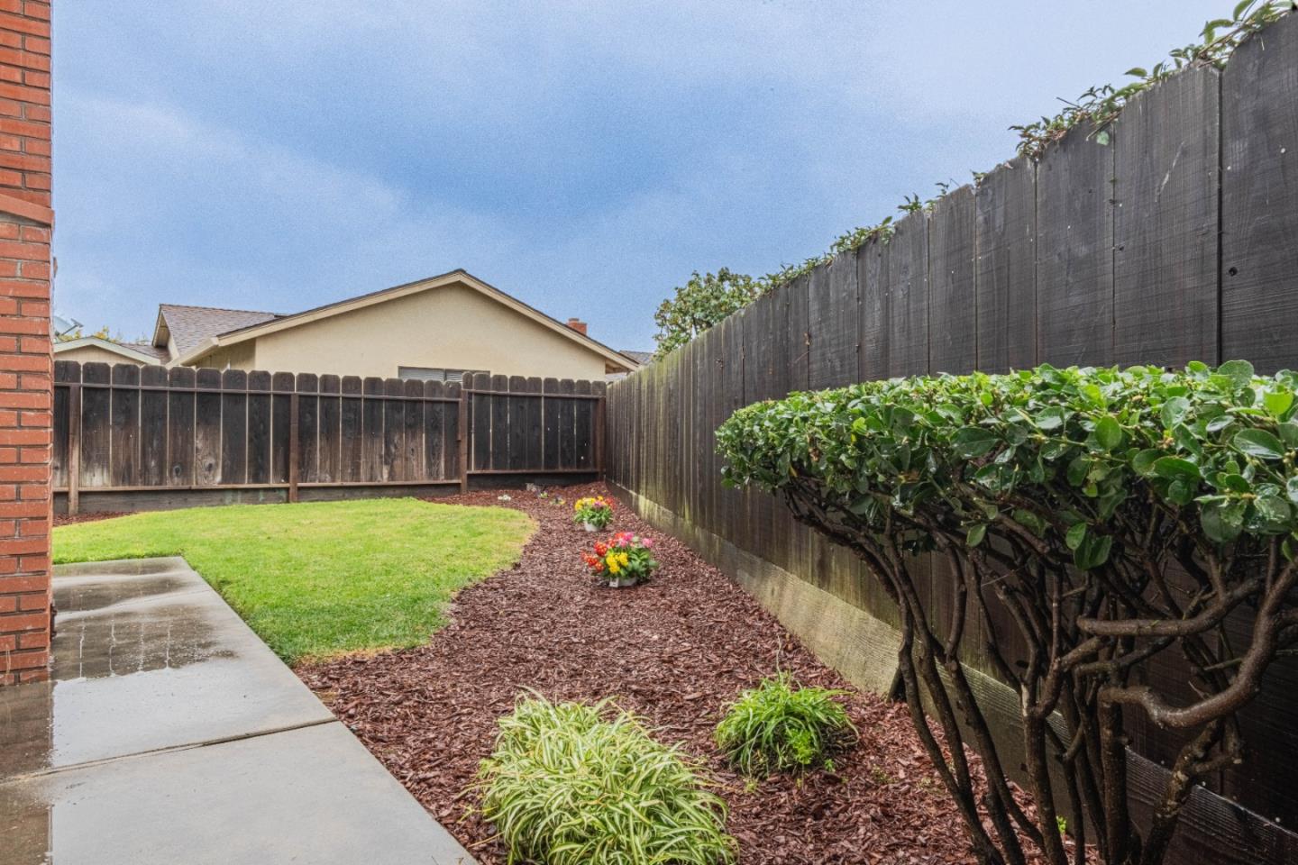 1130 Montecito Circle Salinas, CA 93901 - Photo 31 of 32 a front view of a house with a yard and table and chairs
