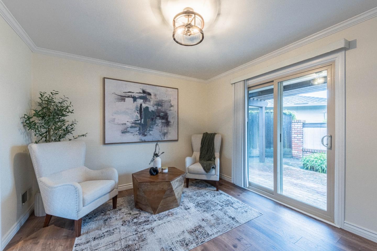 1130 Montecito Circle Salinas, CA 93901 - Photo 7 of 32 a view of workspace filled with furniture and wooden floor