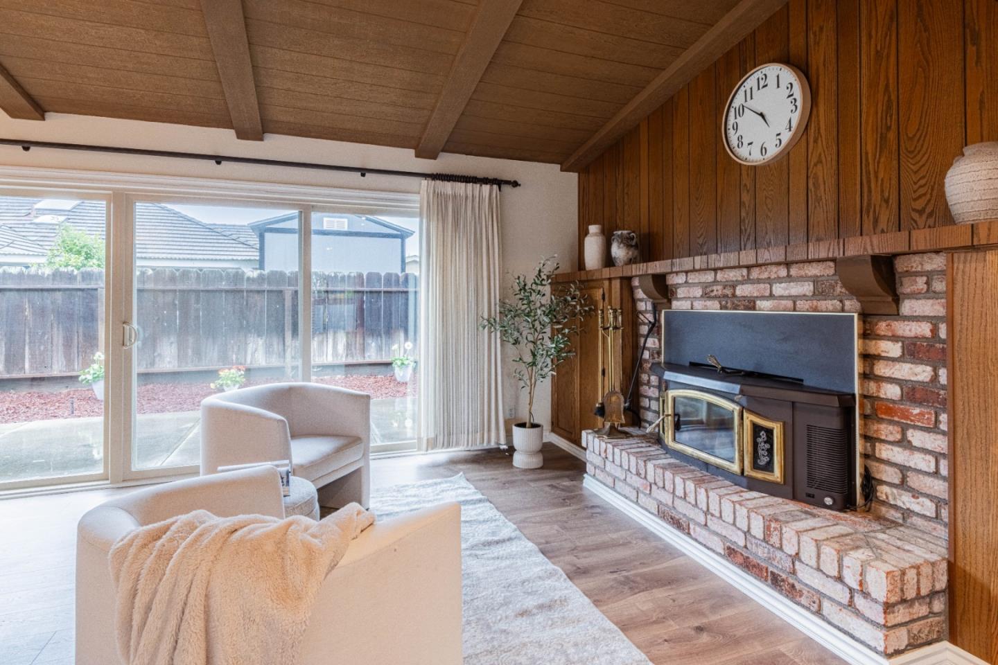1130 Montecito Circle Salinas, CA 93901 - Photo 10 of 32 a living room with furniture a clock and a fireplace
