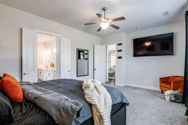 a bedroom with a bed and a couch