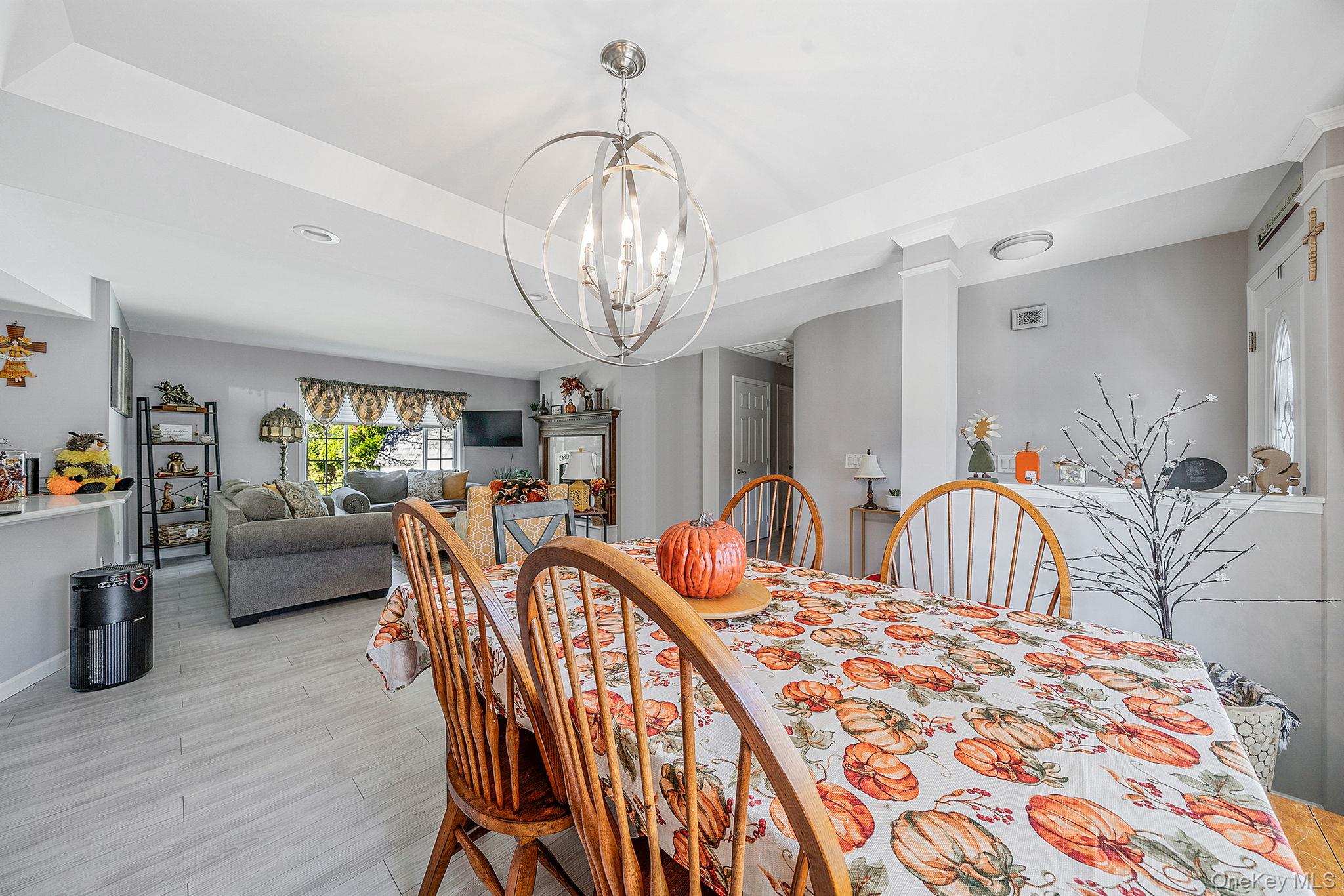 1407 Middle Road, Unit 258 Calverton, NY 11933 - Photo 14 of 50 a view of a dining room with furniture