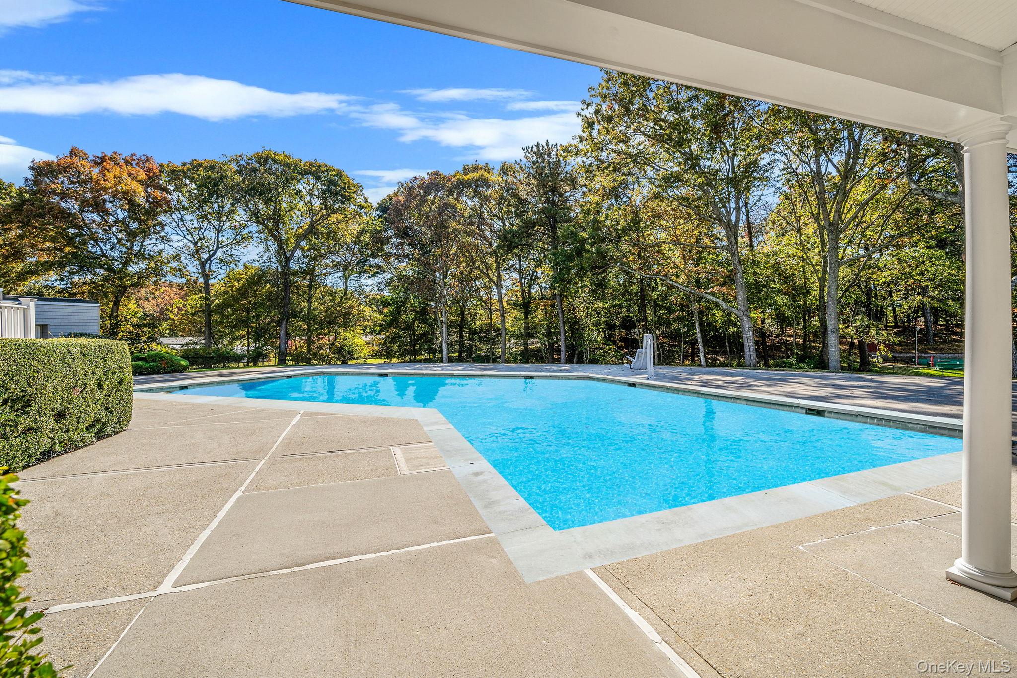 1407 Middle Road, Unit 258 Calverton, NY 11933 - Photo 47 of 50 a view of an outdoor space and tennis court