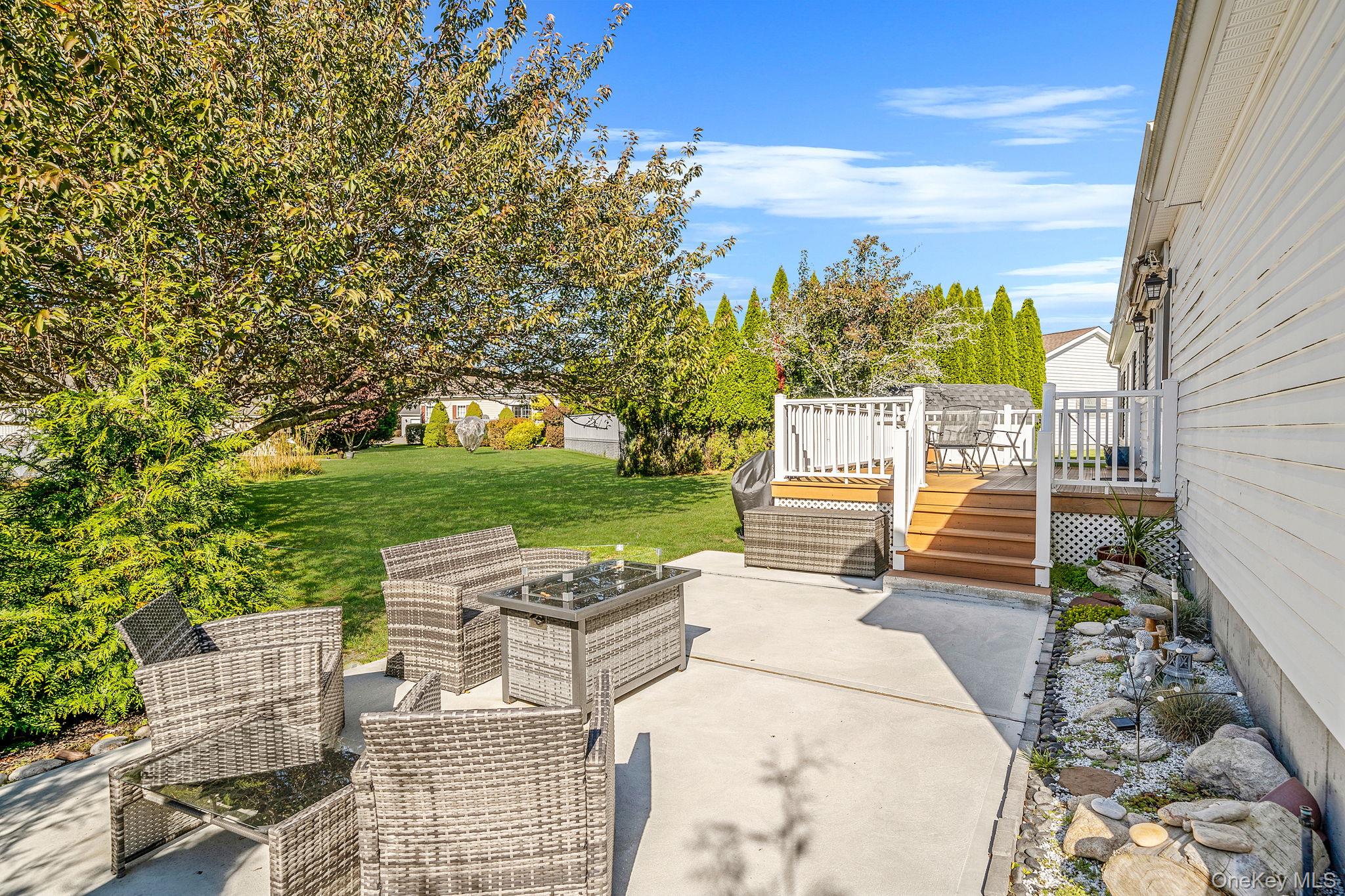 1407 Middle Road, Unit 258 Calverton, NY 11933 - Photo 7 of 50 a view of a patio with a yard