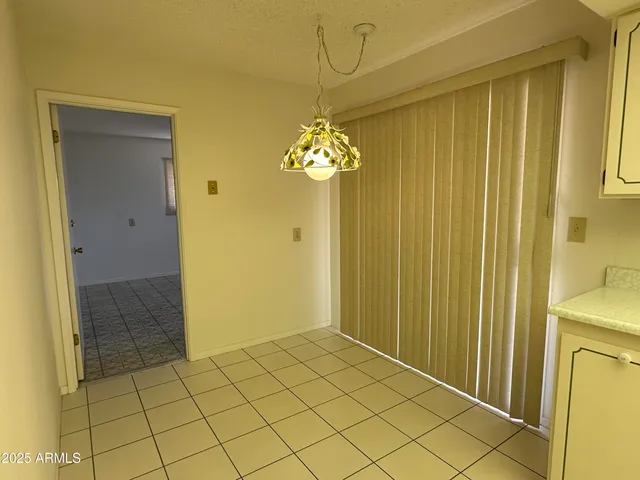 a view of a storage & utility room with a window