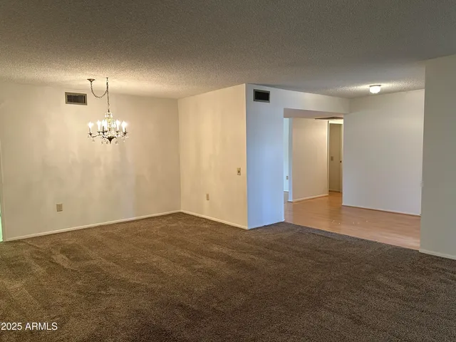 a view of an empty room with a bathroom