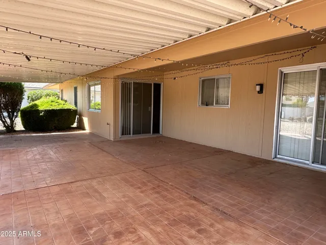 a view of a porch next to a building